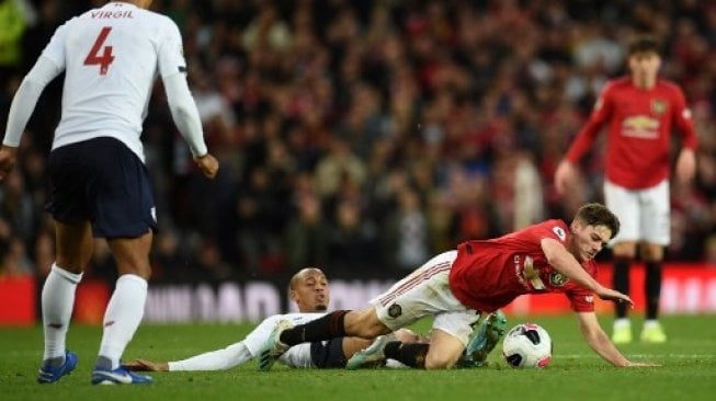 Suasana pertandingan antara Manchester United vs Liverpool di pekan kesembilan Liga Primer Inggris. (OLI SCARFF / AFP)