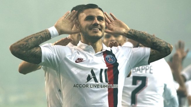 Penyerang PSG, Mauro Icardi melakukan selebrasi usai menjebol gawang Club Brugge pada gelaran Liga Champions 2019/20, Rabu (23/10/2019). [Kenzo TRIBOUILLARD / AFP]