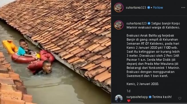 Aksi dua anggota Korps Marinir evakuasi balita korban banjir. (Instagram/@suhartono323)