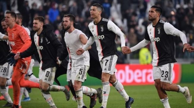 Cristiano Ronaldo dan para pemain Juventus merayakan kemenangan atas Cagliari dalam lanjutan Liga Italia di Juventus Allianz stadium, Turin. Marco Bertorello / AFP