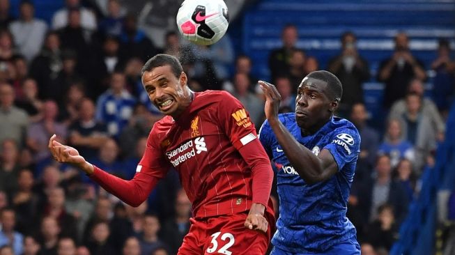 Bek sentral Liverpool, Joel Matip (kiri). [Ben STANSALL / AFP]