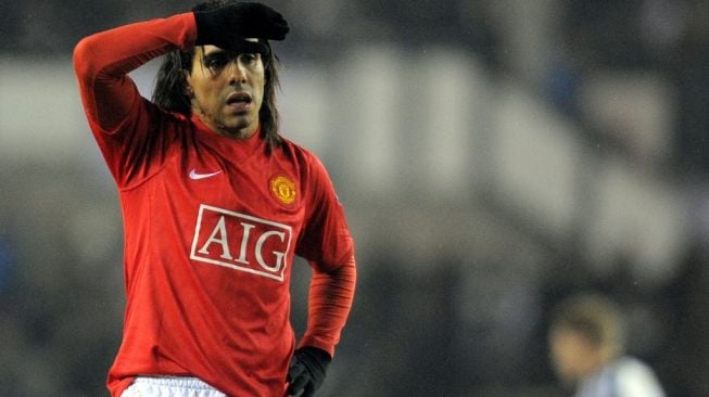 Carlos Tevez saat masih memperkuat Manchester United pada 2009 silam. [ANDREW YATES / AFP]