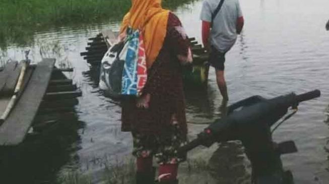 Jalan di Desa Jebus Muaro Jambi Terendam Banjir