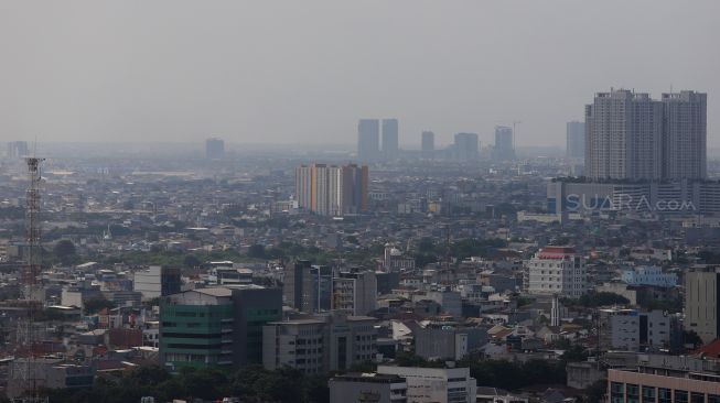 Suasana deretan permukiman penduduk dilihat dari gedung Perpustakaan Nasional, Jakarta, Selasa (4/2).[Suara.com/Angga Budhiyanto]