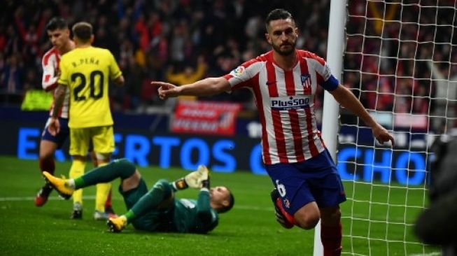 Gelandang Atletico Madrid Koke merayakan golnya ke gawang Villarreal CF dalam laga Liga Spanyol di Wanda Metropolitano stadium, Madrid. GABRIEL BOUYS / AFP