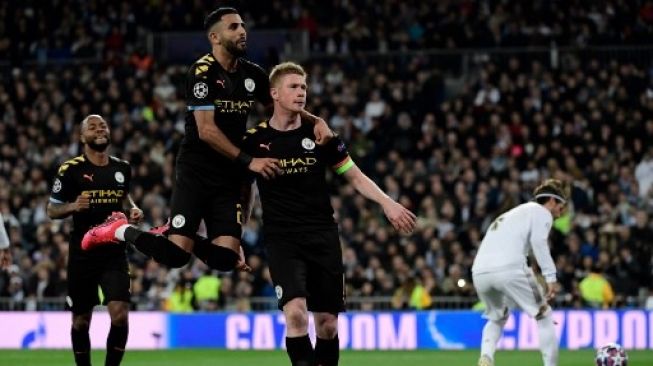 Para pemain Manchester City merayakan gol Kevin De Bruyne ke gawang Real Madrid. (JAVIER SORIANO / AFP)