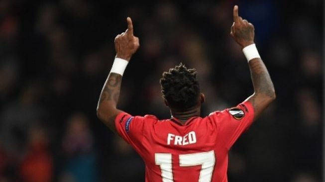 Gelandang Manchester United Fred merayakan golnya ke gawang Club Brugge dalam laga leg kedua babak 32 besar Liga Europa di Old Trafford. Oli SCARFF / AFP