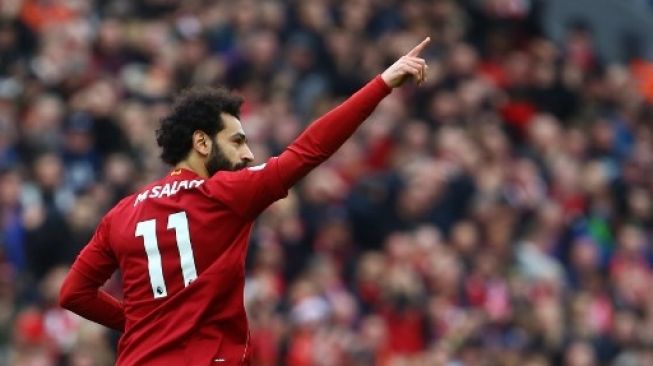 Pemain Liverpool Mohamed Salah rayakan golnya ke gawang AFC Bournemouth di Anfield, Sabtu (7/3/2020). [AFP]