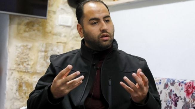 Firas Al-Qazzaz, Muazin di Komplek Masjid Al-Aqsa, Yerusalem, Palestina. [AFP/Ahmad Gharabli]