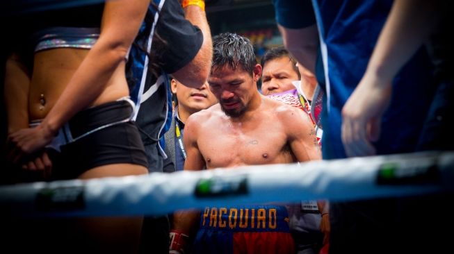 Ekspresi legenda tinju dunia Manny Pacquiao usai kalah angka dari petinju tuan rumah, Jeff Horn, di Suncorp Stadium, Brisbane, Australia, Sabtu (2/7/2017). [AFP/Patrick Hamilton]