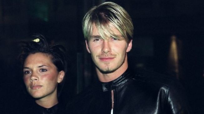 David Beckham bersama sang istri, Victoria. (SINEAD LYNCH/AFP).