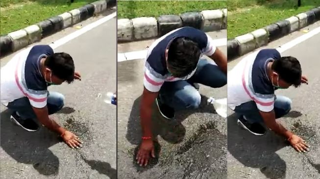 Pria ini terpaksa harus membersihkan air ludahnya sendiri di jalan (Youtube-The Tribune)