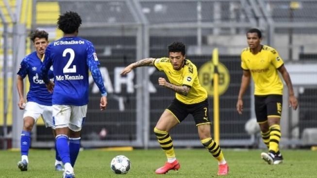 Laga Borussia Dortmund v Schalke 04 pada lanjutan Bundesliga pekan ke-26. (MARTIN MEISSNER / POOL / AFP)