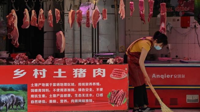 Pasar Wuhan, China. [Hector Retamal/AFP]