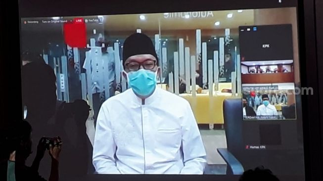 Mantan Menteri Pemuda dan Olah Raga Imam Nahrawi divonis 7 tahun penjara, dan denda Rp 400 juta subsider kurungan penjara tiga bulan, karena terbukti melakukan korupsi. [Suara.com/Welly Hidayat]