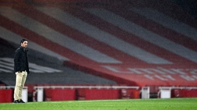 Manajer Arsenal Mikel Arteta di pinggir lapangan melihat skuatnya menghadapi Leicester City dalam lanjutan Liga Inggris di Emirates Stadium. Shaun Botterill / POOL / AFP