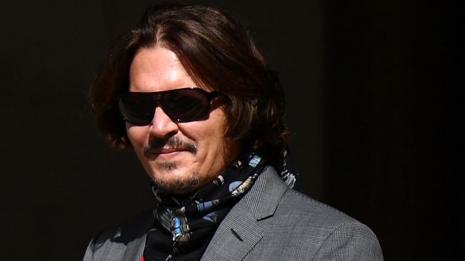 Aktor Johnny Depp tiba di Pengadilan Tinggi di London, Britain, Senin (20/7/2020). [Niklas HALLE'N / AFP]