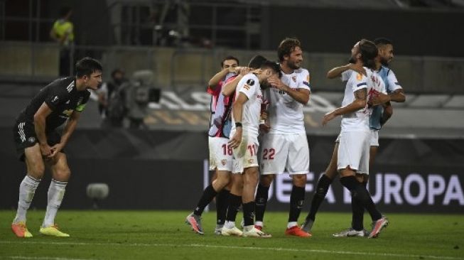 Pemain depan Sevilla Luuk De Jong merayakan golnya ke gawang Manchester United di semifinal Liga Europa di Koln. Ina Fassbender / POOL / AFP