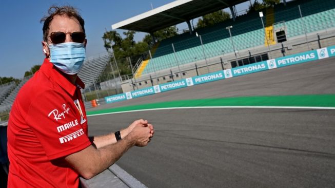 Pebalap Ferrari, Sebastian Vettel di Sirkuit Monza, Italia. [MIGUEL MEDINA / POOL / AFP]