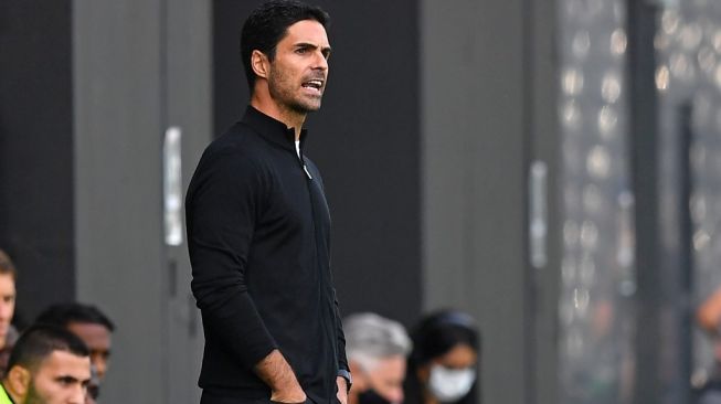 Ekspresi manajer Arsenal, Mikel Arteta pada laga Liga Inggris 2020/2021 kontra Fulham di Craven Cottage, London, Sabtu (13/9/2020) malam WIB. [BEN STANSALL / POOL / AFP]