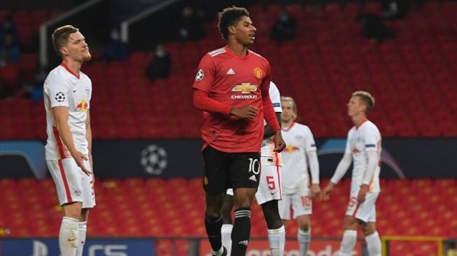 Striker Manchester United Marcus Rashford mencetak hattrick saat menjamu Leipzig di matchday kedua Liga Champions di Stadion Old Trafford, Kamis (29/10/2020) dini hari WIB. (Foto: AFP/Anthony Devlin)