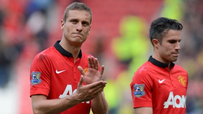 Mantan bek Manchester United, Nemanja Vidic (kiri). [ANDREW YATES / AFP]