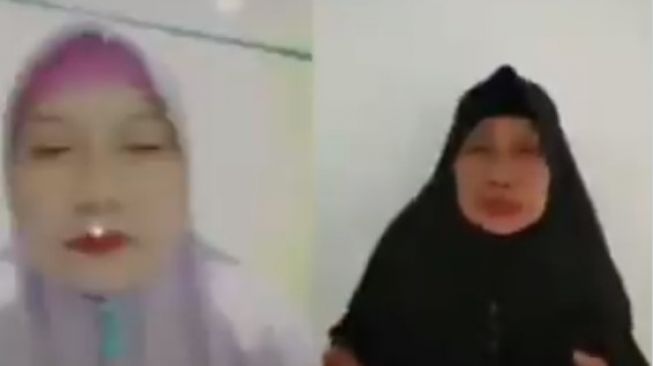 Ratu Wiraksini, Emak-emak berjilbab menghina polisi dengan sebutan dajjal. 