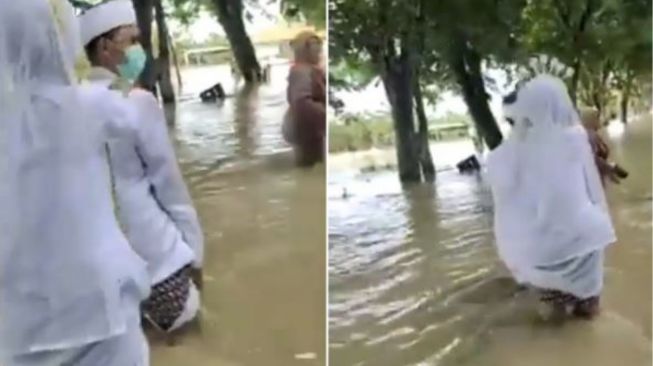 Demi Menikah, Pasangan Pengantin Ini Nekat Jalan Kaki Menerjang Banjir