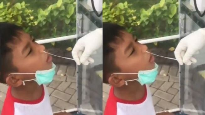 Ekspresi Bocah Swab Test Bikin Bingung, Ketawa Apa Nangis?