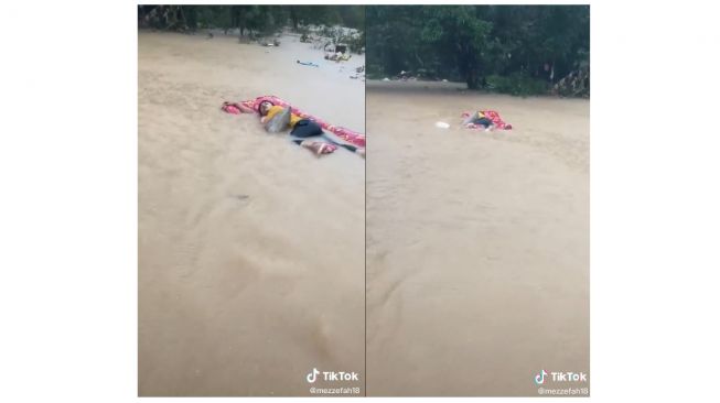 Seorang pemuda tertidur pulas meski banjir melanda dan menghanyutkannya (tiktok.com/@mezzefah18)