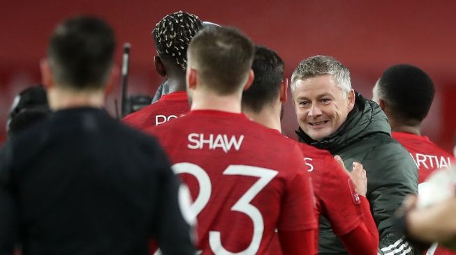 Manajer Manchester United, Ole Gunnar Solskjaer (kanan). [MARTIN RICKETT / POOL / AFP]