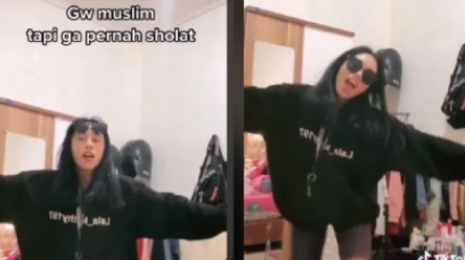 Seorang perempuan pakai baju hitam joget TikTok gue muslim tapi nggak pernah sholat. Sikap bangga tak pernah sholat itu pun viral dan mendapat cibiran dari netizen. 