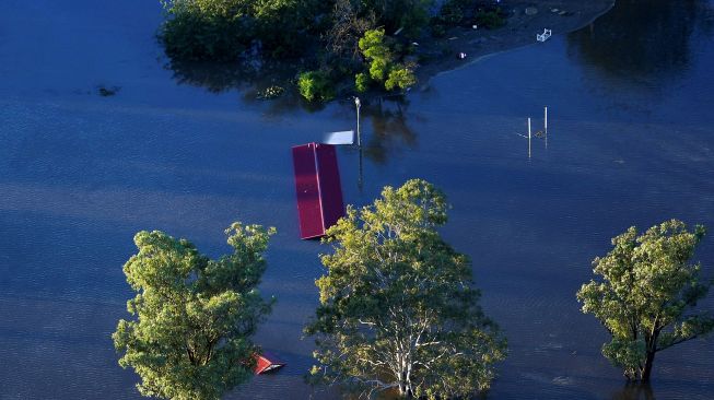 Suasana banjir di daerah Windsor, Sydney, Australia, Rabu (24/3).  LUKAS COCH / POOL / AFP
