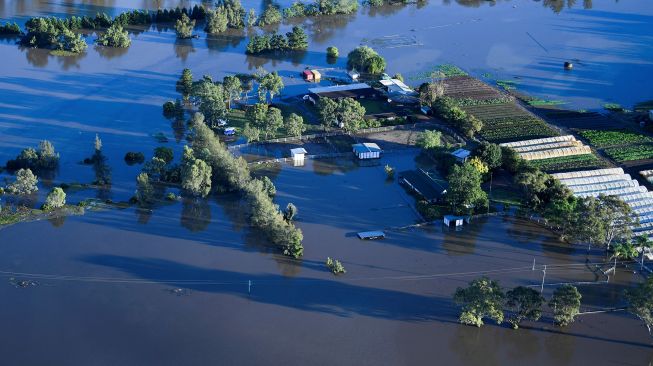 Suasana banjir di daerah Windsor, Sydney, Australia, Rabu (24/3).  LUKAS COCH / POOL / AFP
