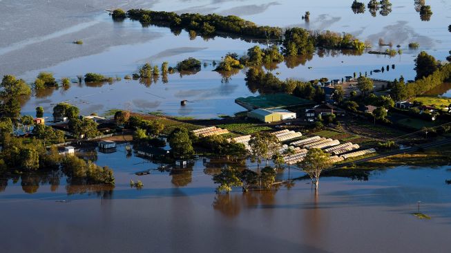 Suasana banjir di daerah Windsor, Sydney, Australia, Rabu (24/3).  LUKAS COCH / POOL / AFP
