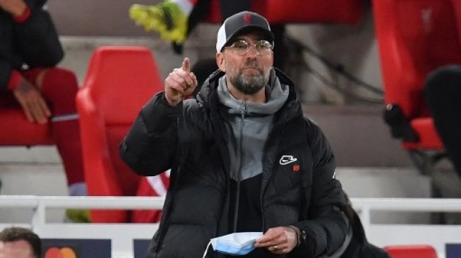 Reaksi Manajer Liverpool Jurgen Klopp dipinggir lapangan setelah saat skuatnya menjamu Real Madrid di leg kedua perempat final Liga Champions di Anfield. Paul ELLIS / AFP