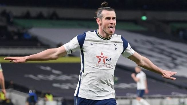 Gelandang Tottenham Hotspur Gareth Bale merayakan golnnya ke gawang Sheffield United dalam lanjutan Liga Inggris di Tottenham Hotspur Stadium, London. Shaun Botterill / POOL / AFP