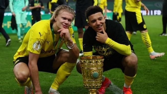 Jadon Sancho dan Erling Haaland sukses antara Borussia Dortmund juara DFB Pokal. (MARTIN ROSE / POOL / AFP)