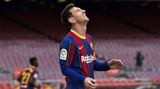 Ekspresi kekecewaan megabintang Barcelona, Lionel Messi pada laga Liga Spanyol 2020/2021 kontra Celta Vigo di Camp Nou, Senin (17/5/2021) dini hari WIB. [Pau BARRENA / AFP]