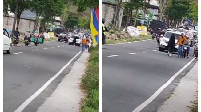 Perempuan ngambek di jalan bikin macet jalan. Videonya beredar di media sosial.