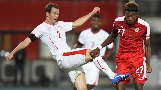 Bintang Timnas Austria, David Alaba (kanan). [JOE KLAMAR / AFP]