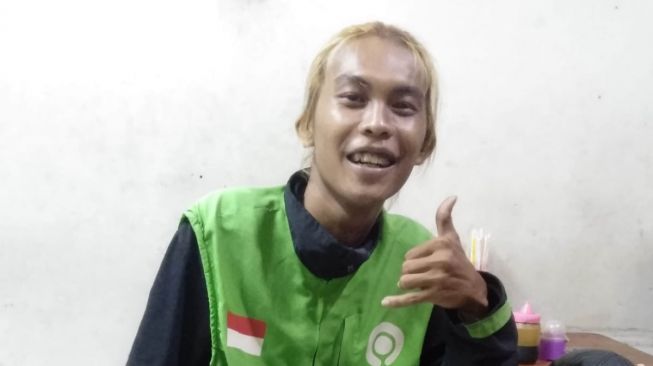 Eko Saiful Nur Amin, driver ojek online penyandang disabilitas yang bertugas di layanan pengiriman barang dan memiliki tagar #pendekartangansatu (dok pribadi  Eko Saiful Nur Amin)