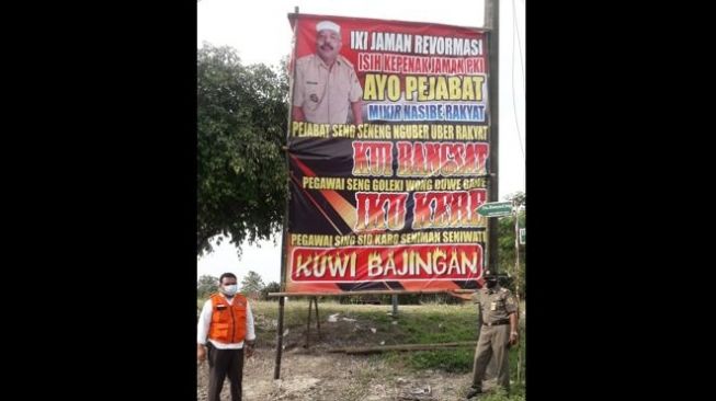 Ngeri! Kades di Sragen Pasang Baliho Tak Percaya Covid-19 hingga Umpat Pejabat