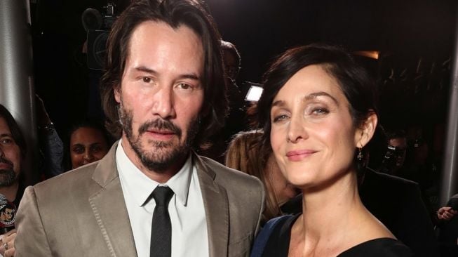 Keanu Reeves dan Carrie-Anne Moss [Instagram @carrieanne.moss]