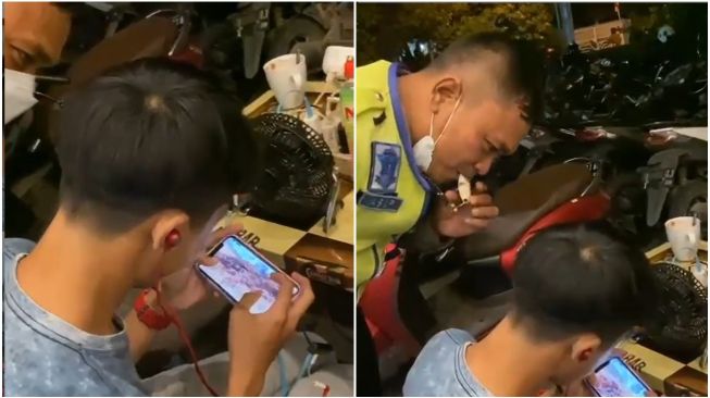 Pemuda Cuek Tetap Main Game saat Ditegur Polisi, Publik Heran: Adik Siapa tuh?