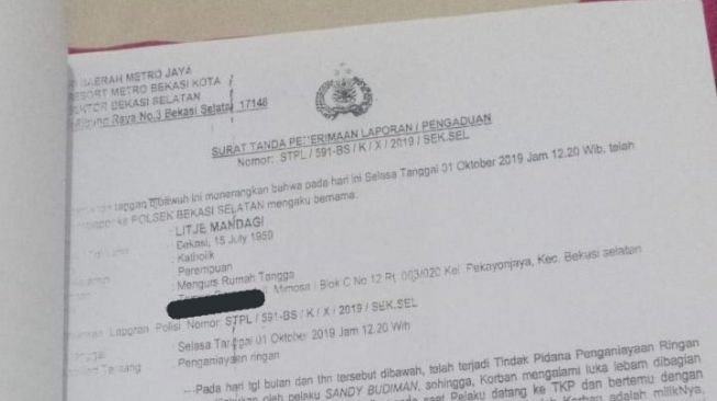 Foto bukti laporan polisi yang diunggah akun Lisa Mandagi 