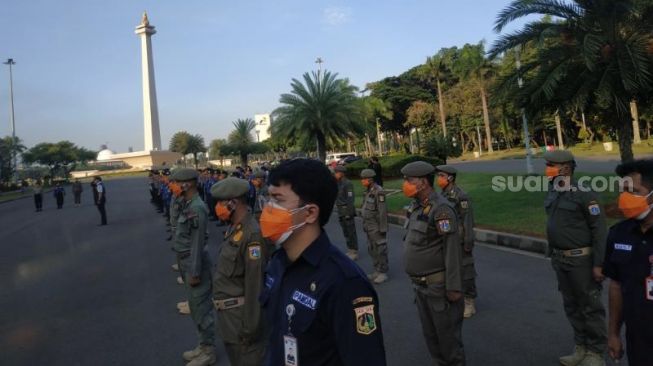 Acara pembubaran tim pemulasaraan jenazah COVID-19 di Monas, Jakarta Pusat, Rabu (22/9/2021). [Suara.com/Fakhri Fuadi Muflih]