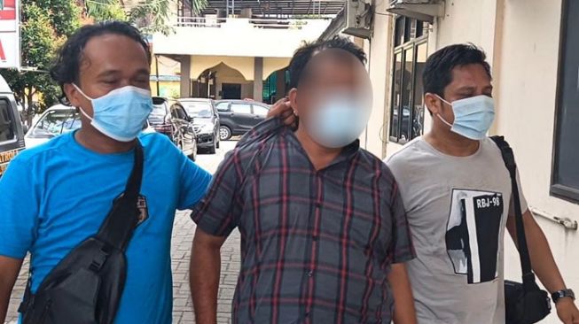 Polisi membekuk Ketua OKP di Medan setelah video punglinya viral. [Ist]