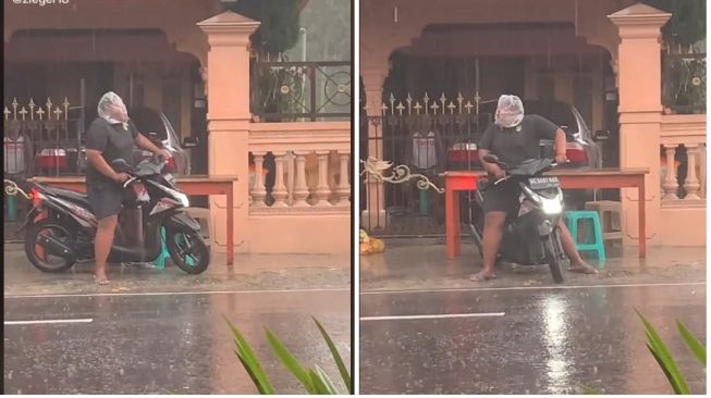 Pemotor menggunakan kantong kresek untuk membungkus kepala guna melindungi dari air hujan (TikTok)