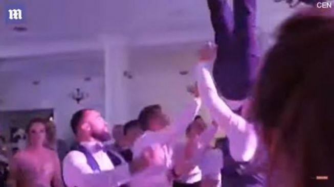 Potongan video aksi melempar pengantin yang membuat mempelai pria cedera (Youtube)